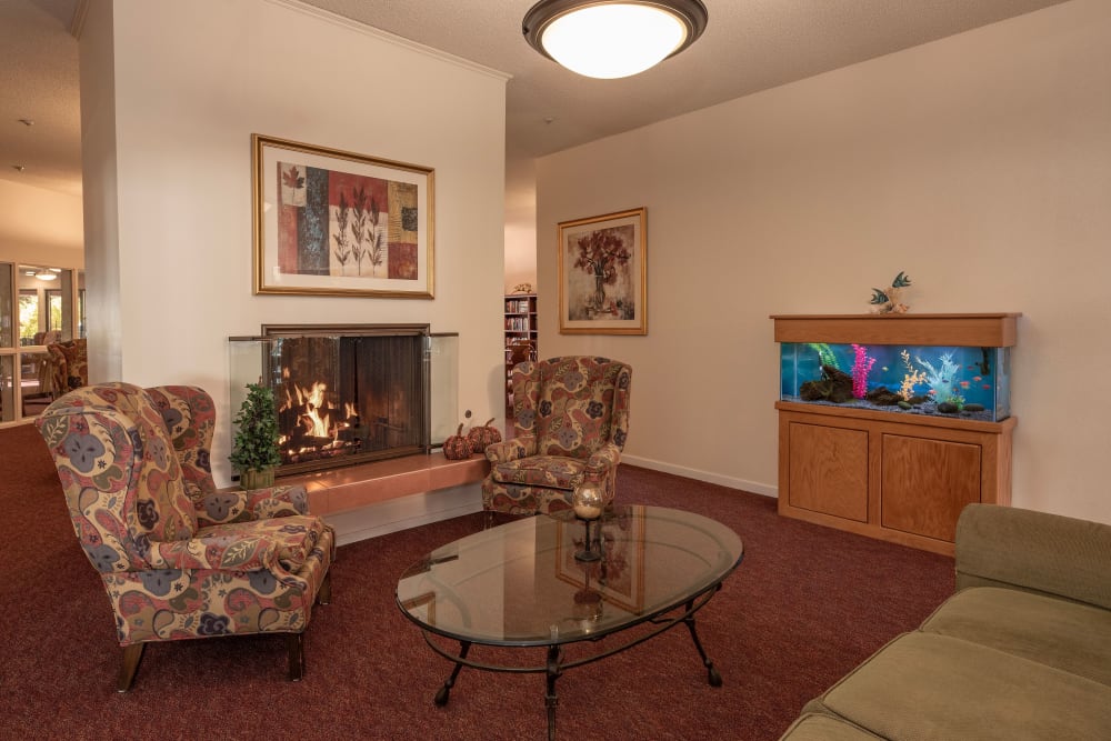 Common area with fireplace at Roseville Commons Senior Living in Roseville, California