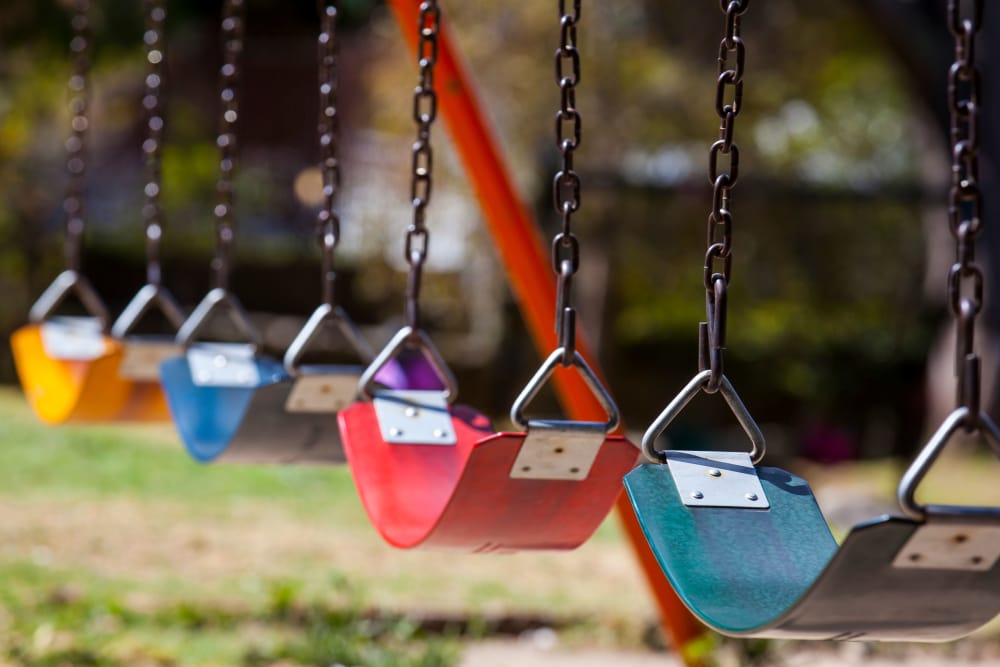 Swing set at the playground near E Street Apartments in Sacramento, California
