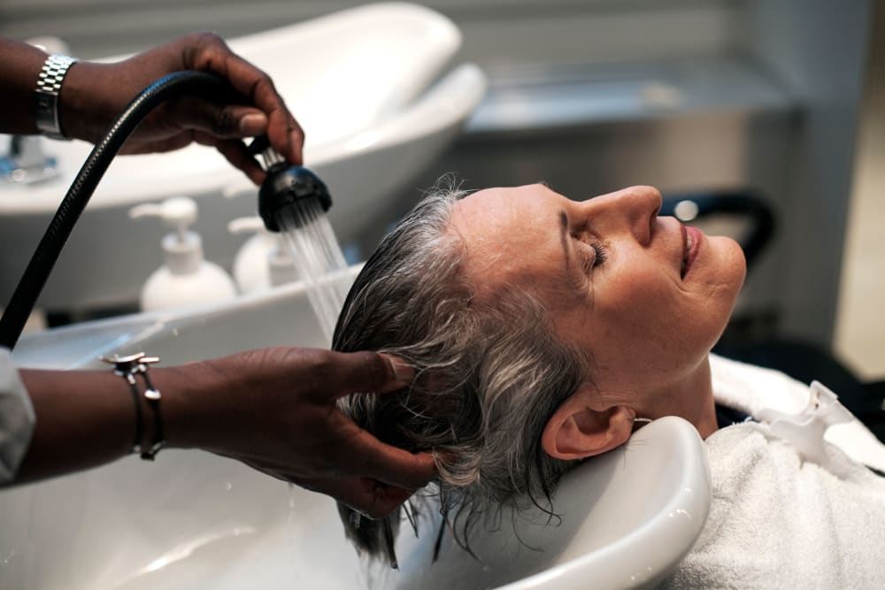 Woman having her hair washed at The Pinnacle at Plymouth Meeting in Plymouth Meeting, Pennsylvania