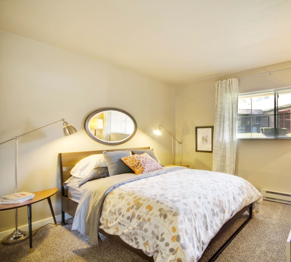 Master bedroom with plush carpeting at The Carriages at Fairwood Downs in Renton, Washington