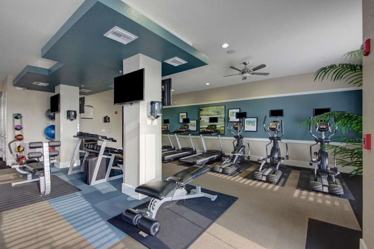 Well-equipped fitness center at The Courtney at Lake Shadow in Orlando, Florida