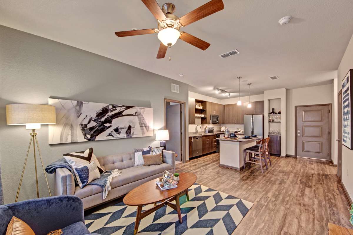 Modern and well-lit living room at The Courtney at Lake Shadow in Orlando, Florida