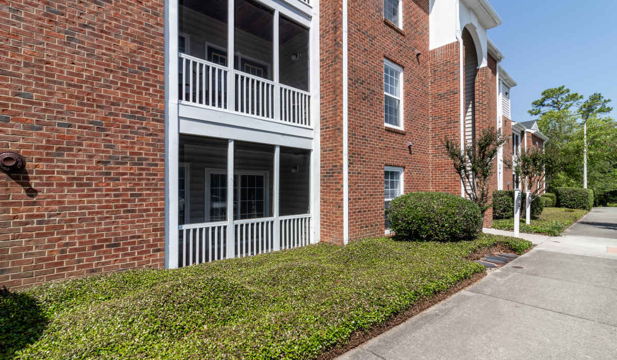 exterior of building with walkway at Sand Ridge in Wilmington, North Carolina