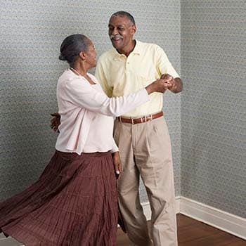 Resident couple dancing at Brookstone Estates of Olney in Olney, Illinois. 