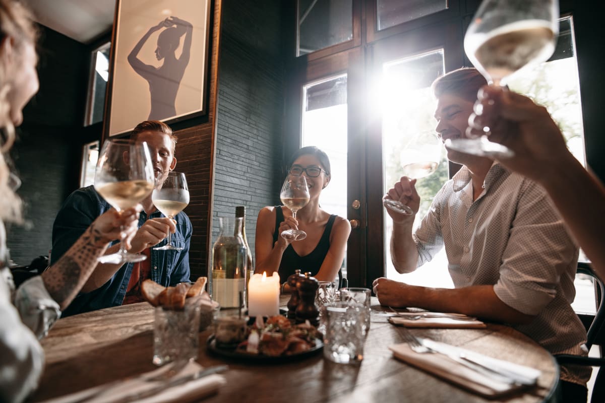 Residents dining in a restaurant near Marquis at Stone Oak in San Antonio, Texas