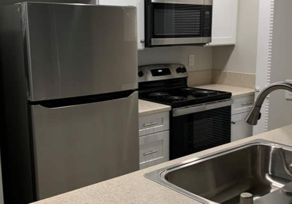Kitchen with range and refrigerator  at Oak Hill in Escondido, California