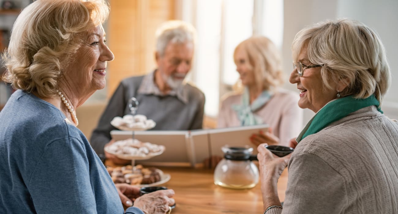 Two residents conversing at Merrill Gardens at Renton Centre in Renton, Washington. 