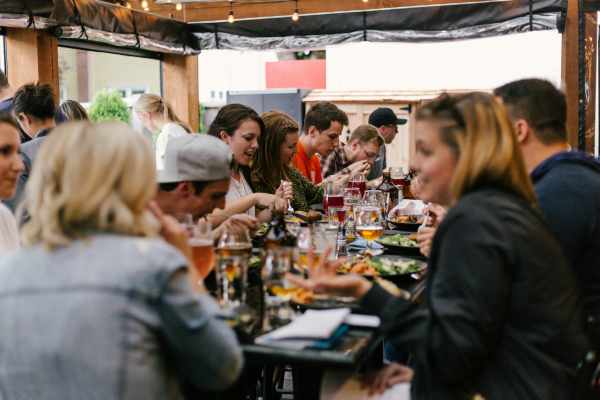 Residents having food at their favorite restaurant near Mission Eagle Pointe in Allen,Texas