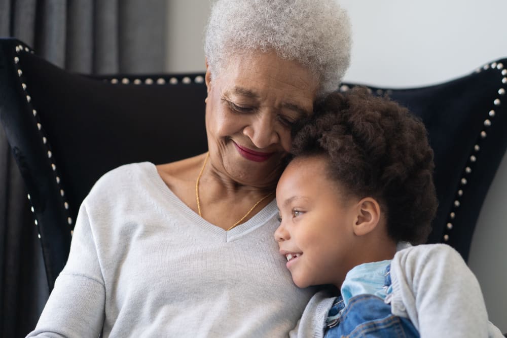 Resident visiting with grandchild at Holden of Bellevue in Bellevue, Washington