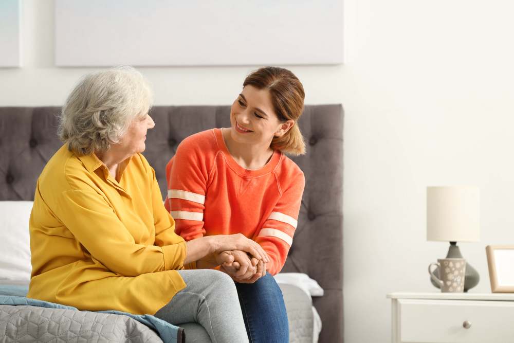 Resident with a caregiver at Glenncrest at Decatur in Decatur, Georgia