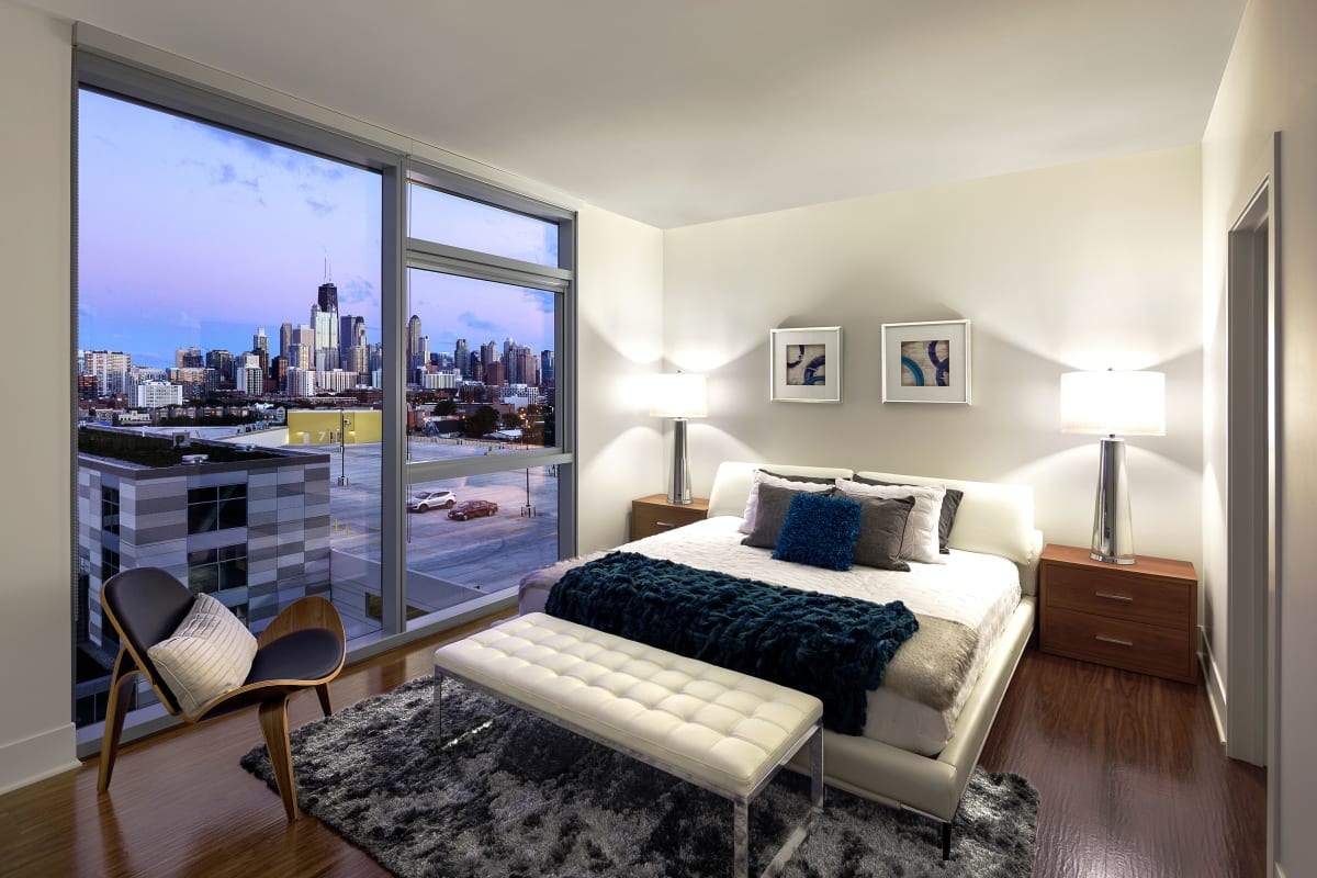 Spacious master bedroom with a back porch access at The Residences at NEWCITY in Chicago, Illinois