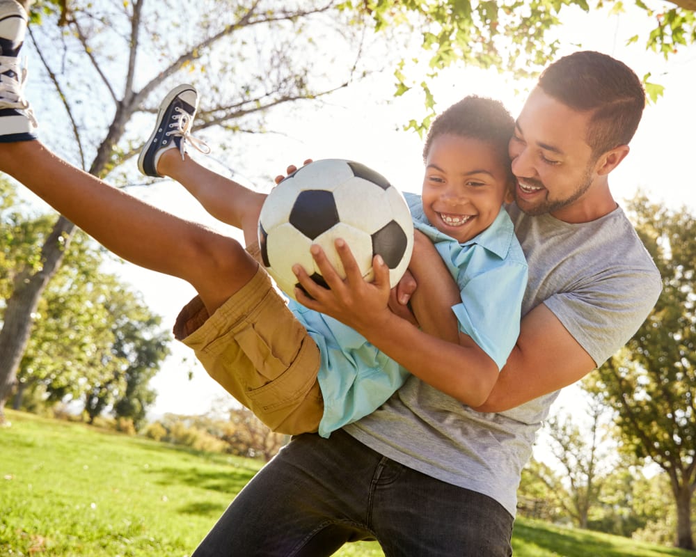 Father and son enjoying their new home at The Palms at Morada in Stockton, California
