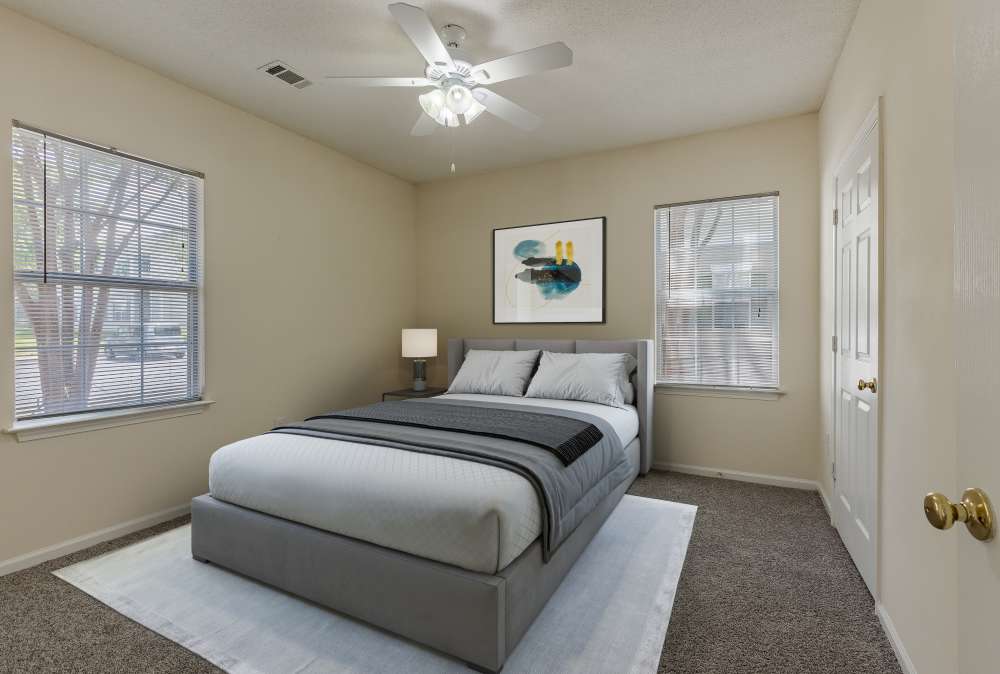 bedroom with carpeting and 2 windows