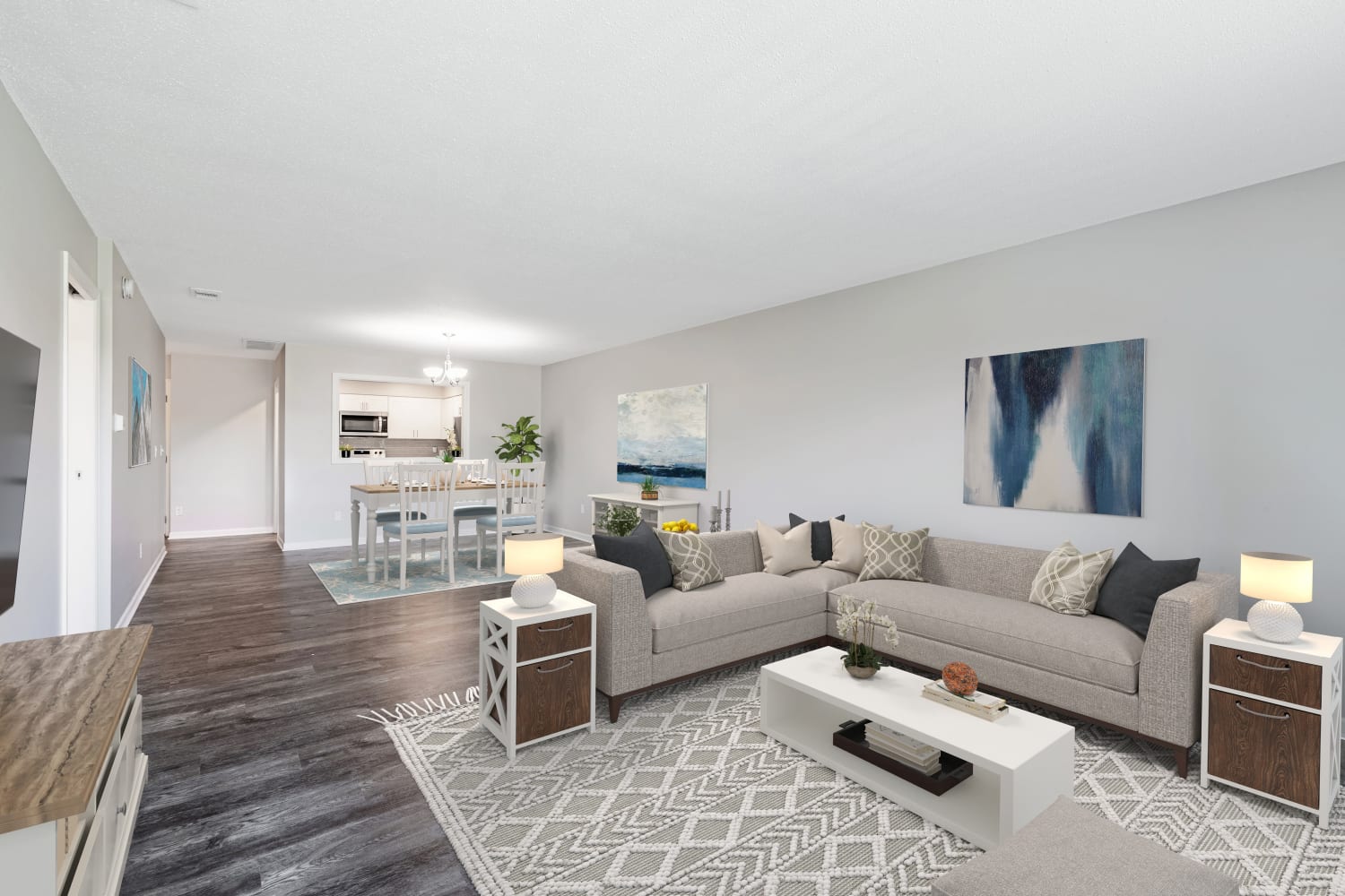 Staged living room with vinyl plank flooring at Regency Lakeside Apartment Homes