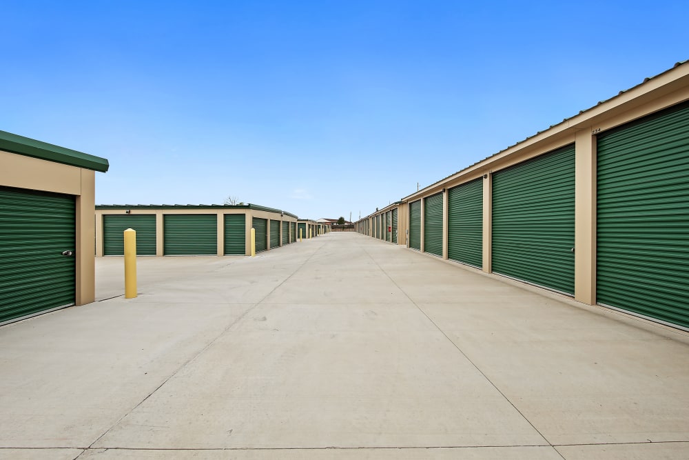 Exterior units with green doors at Storage Star - Anchorage South in Anchorage, Alaska