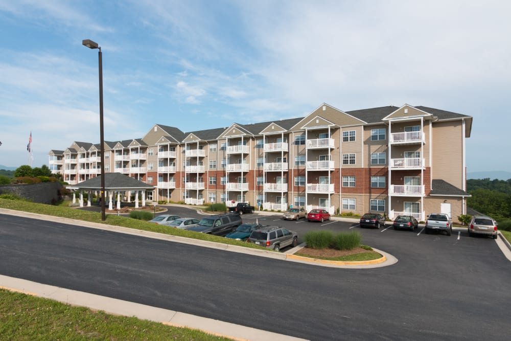 The parking lot and exterior of The Harmony Collection at Roanoke - Independent Living in Roanoke, Virginia