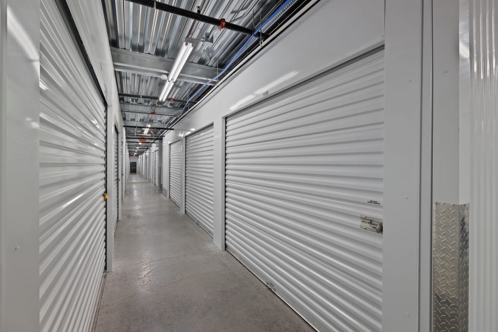 Hallway lined with interior units at StorageOne Blue Diamond & Buffalo in Las Vegas, Nevada