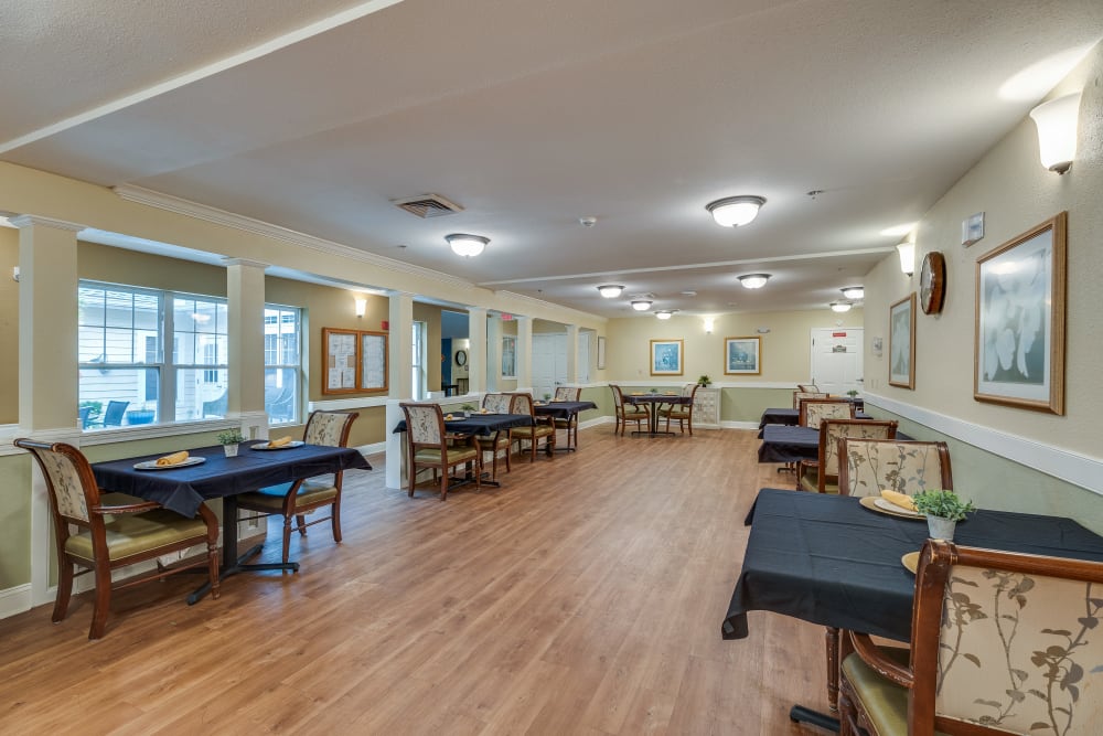 Tables and chairs in the dining room at Harbor Cove Memory Care in Hilton Head Island, South Carolina