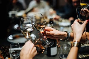 Friends raising a toast to the good life at Mariposa at Bay Colony in Dickinson, Texas