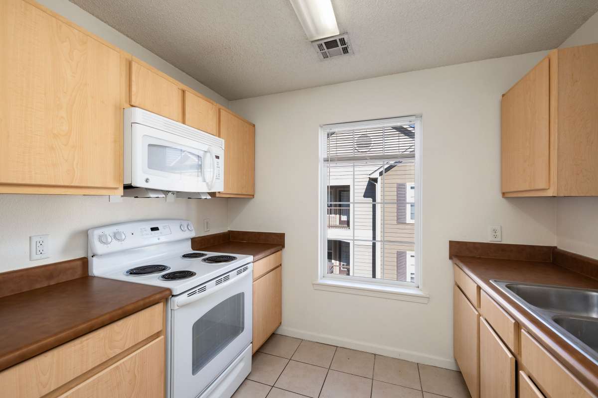 Kitchen with window at The Terraces At Copper Leaf in Nixa, Missouri