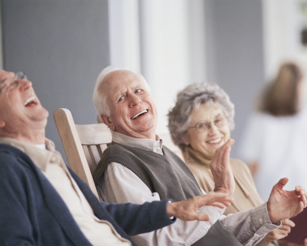 Residents enjoy chatting on the deck at Goodhue Living in Goodhue, Minnesota.