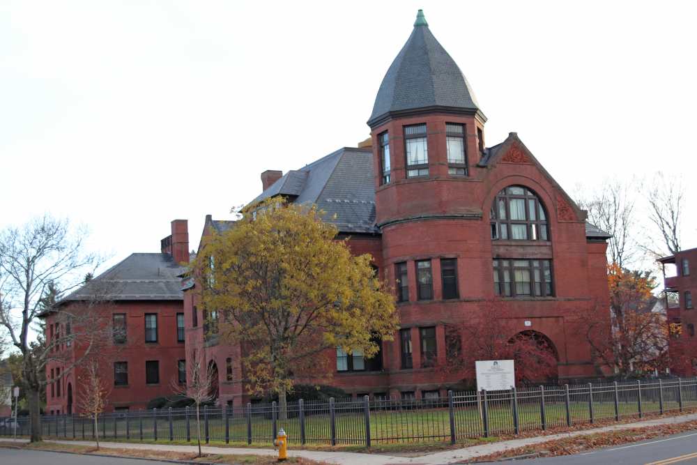 Historic red brick building with unique architecture near Bh Tapley Court in Springfield, Massachusetts