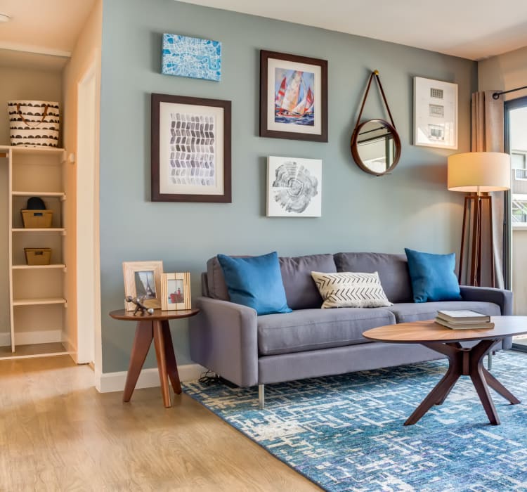 Hardwood flooring and an accent wall in a model home's living space at Sofi Berryessa in San Jose, California