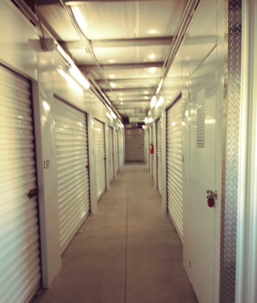 White doors on indoor units at American Self Storage - High Point South in High Point, North Carolina