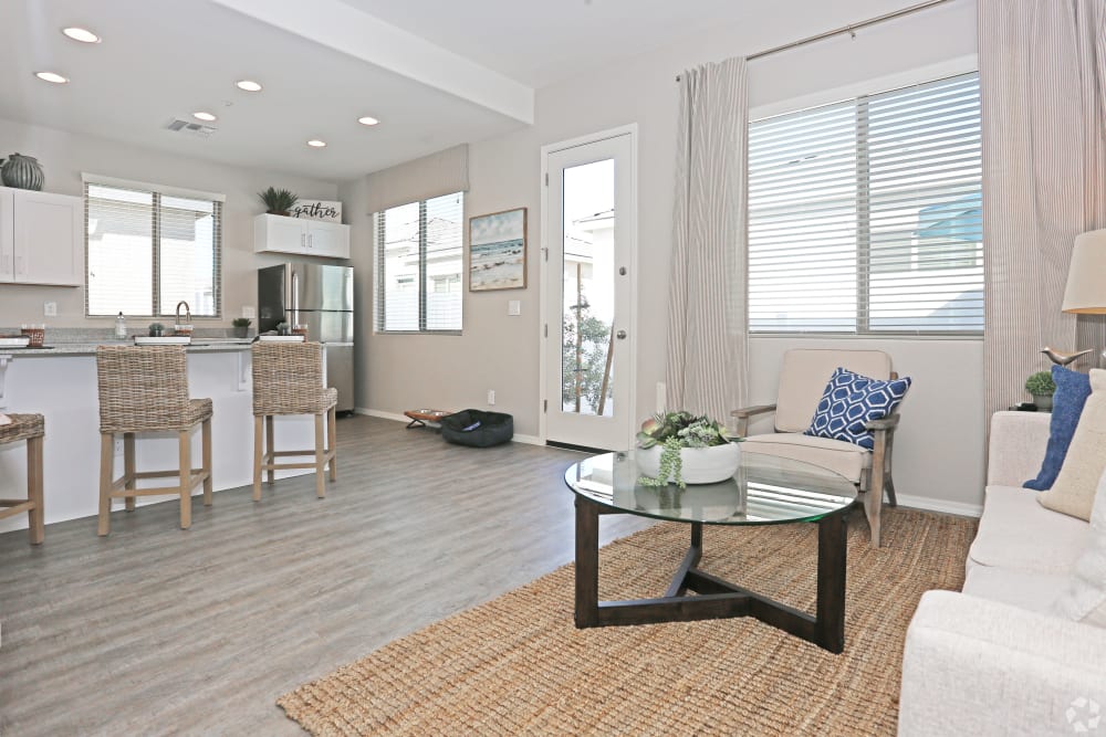 Wood-inspired flooring with high ceilings in model home at Christopher Todd Communities At Stadium in Glendale, Arizona