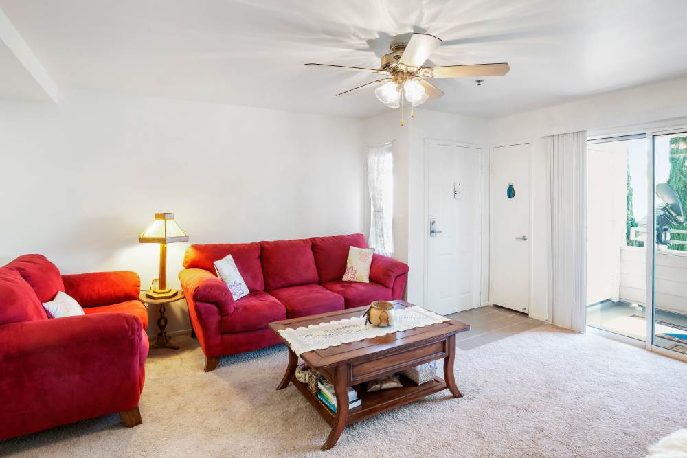 Unit living room at Vista Alicante in La Mirada, California