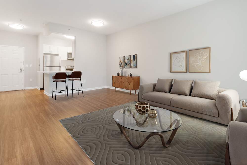 Open concept living room and dining in a model apartment home at The Brunswick in New Brunswick, New Jersey