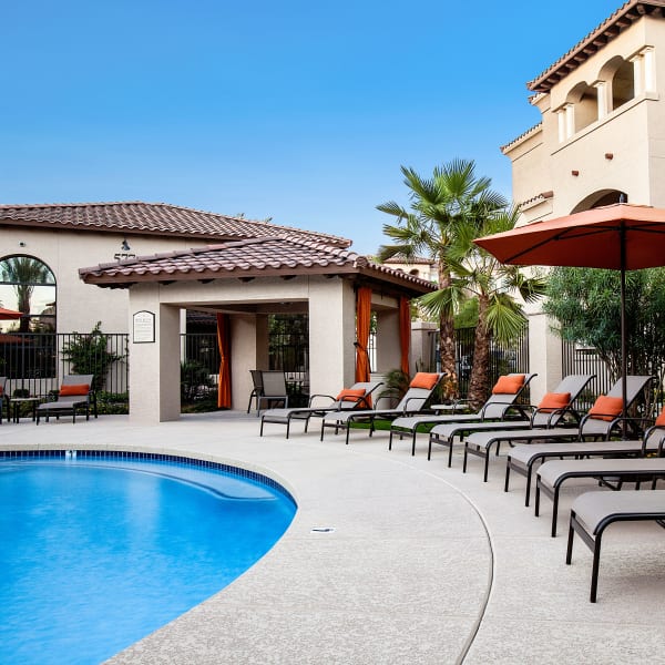 Chaise lounge chairs next to the swimming pool at San Marquis in Tempe, Arizona