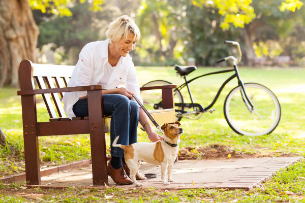 Woman with dog in Columbia near Discovery Village At Sandhill