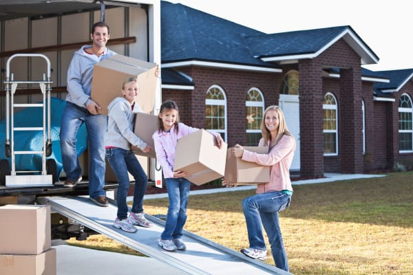 A family moving using the free moving truck at Spacebox Storage in Fort Myers, Florida.
