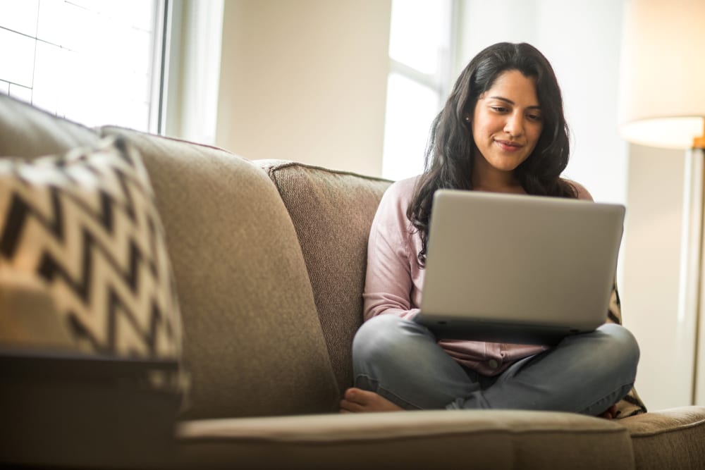 Resident on her computer at Ruxton Tower in Towson, Maryland