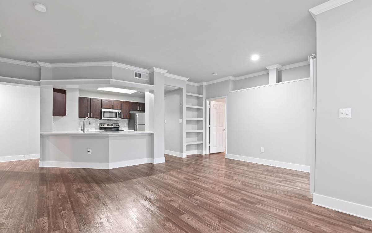 View of kitchen with wood flooring at Carrara At Cole in Dallas, Texas