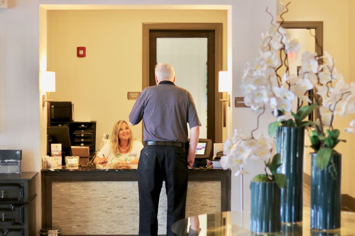 Resident at the front desk of The Reserve at Watermere Woodland Lakes in Conroe, Texas