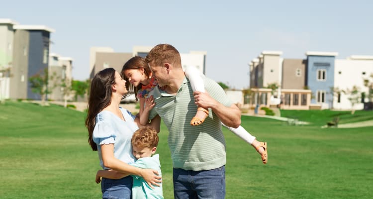 Family playing outside at BB Living at Eastmark in Mesa, Arizona