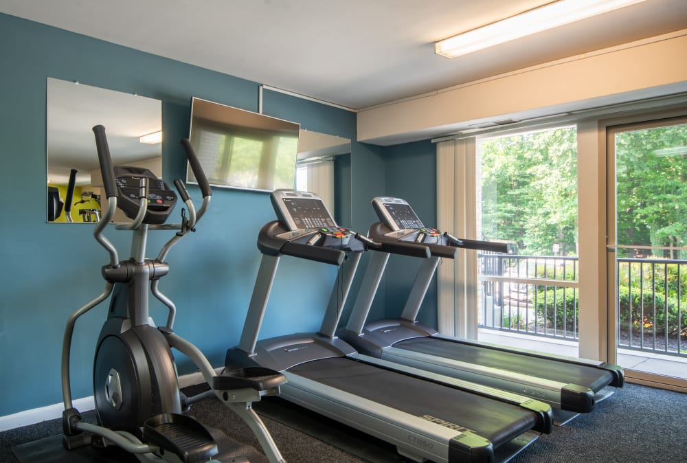 FItness center with cardio equipment at Harbor Place Apartment Homes in Fort Washington, Maryland