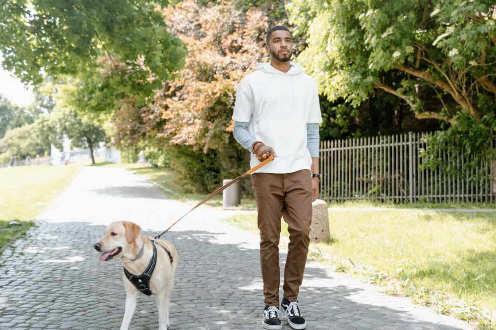 Resident walking his dog at Sage Creek Apartments in Augusta, Georgia