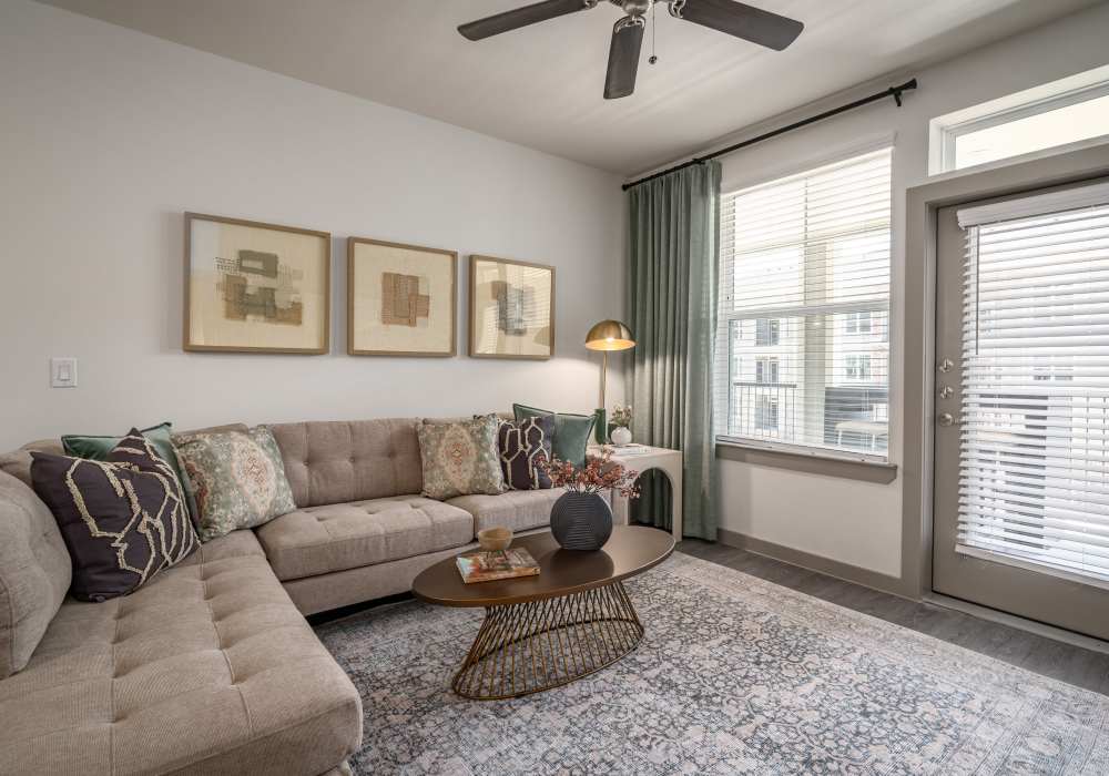 Living room with dining area at Charleston at Fannin Station in Houston, Texas