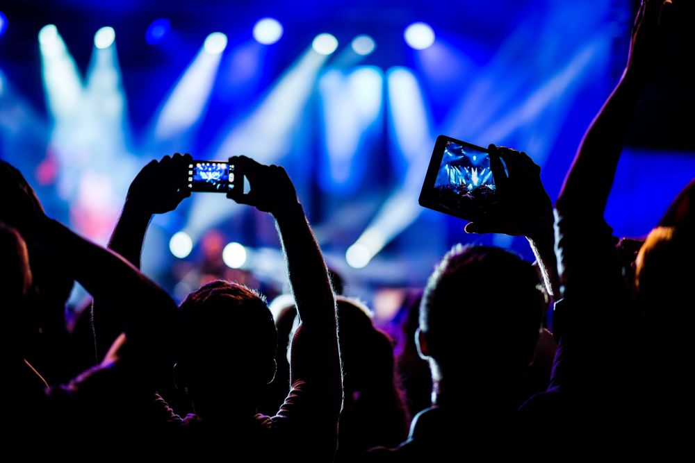 Residents capturing moments of a music concert near Miller Landing in Cleveland, Tennessee