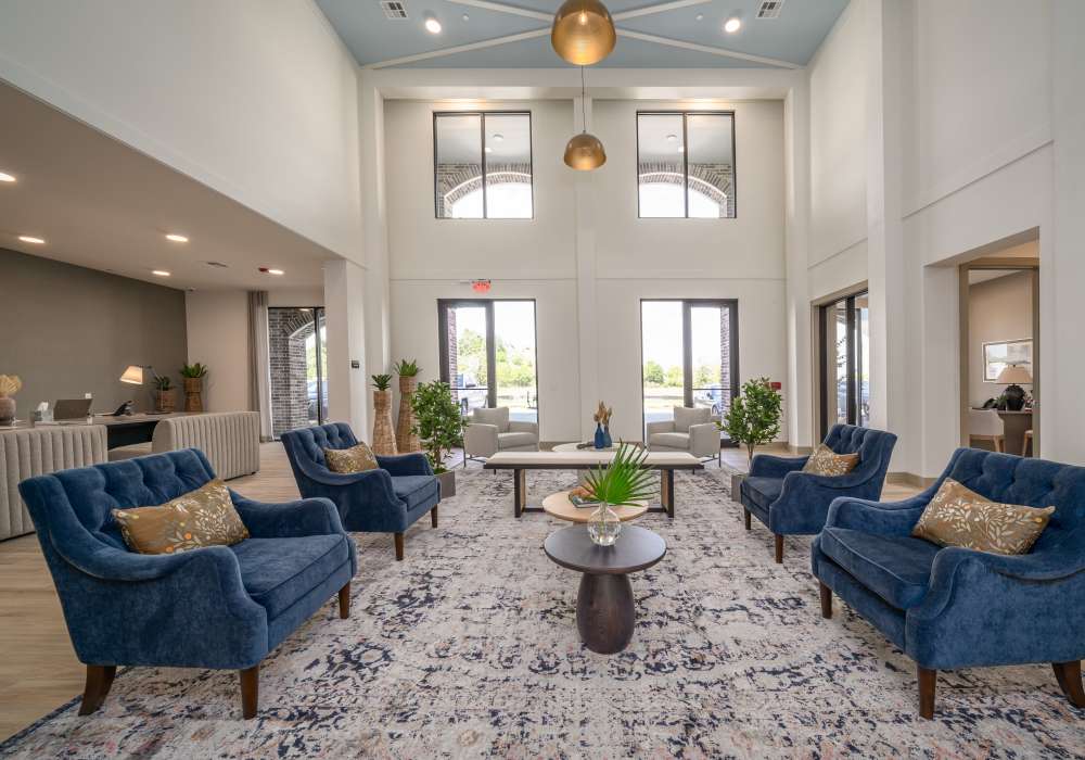Elegant clubhouse lobby featuring a double-height ceiling at Charleston at Fannin Station in Houston, Texas