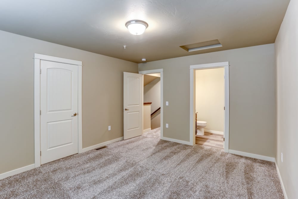 Bedroom with attached bathroom at Cedar Park & Canyon Falls Townhomes in Twin Falls, Idaho