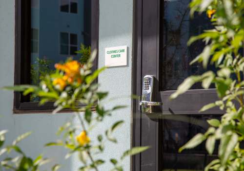 Entry view of the community clothes care center at Norman Commons in Austin, Texas
