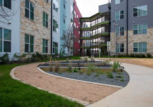 Exterior view of apartment building at Norman Commons in Austin, Texas