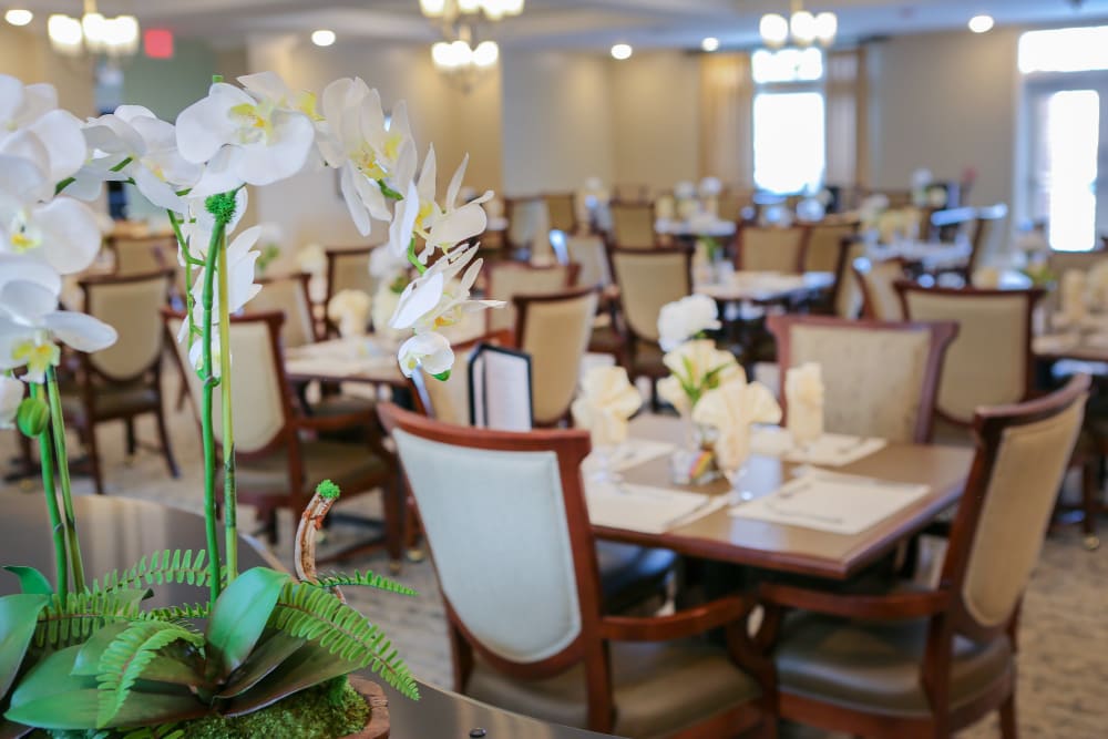 Well decorated dining room tables at Harmony at Spring Hill in Lorton, Virginia