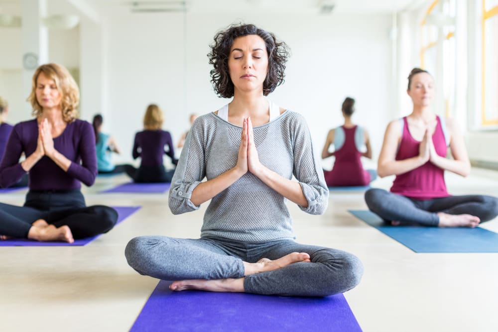 Resident doing yoga in Minnetonka, Minnesota near Oaks Glen Lake
