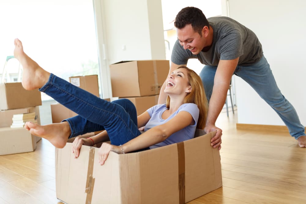 Couple Having Fun Packing