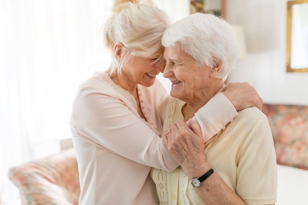 A resident and a lady hugging at Waterview Court in Shreveport, Louisiana.